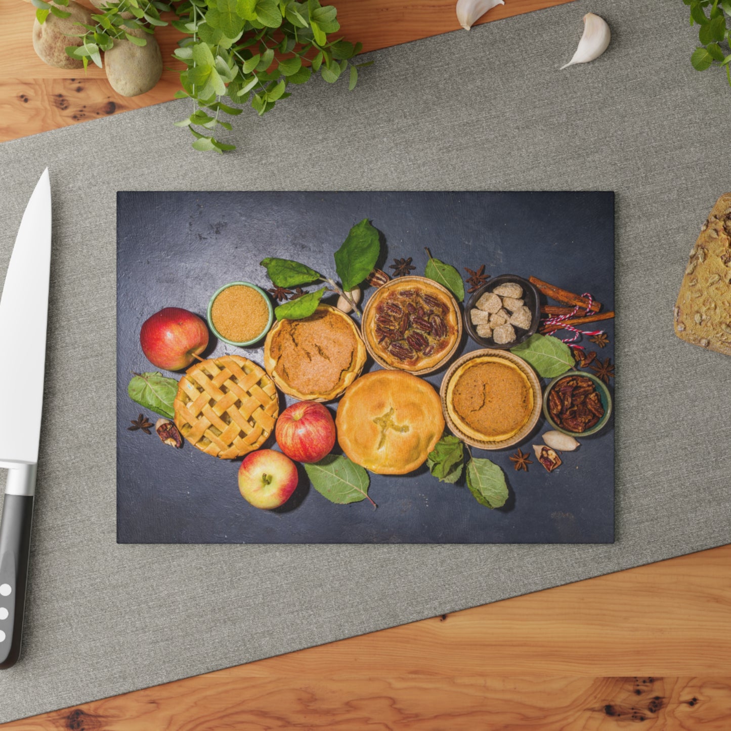 Decorative mat with pies and apples on a gray surface