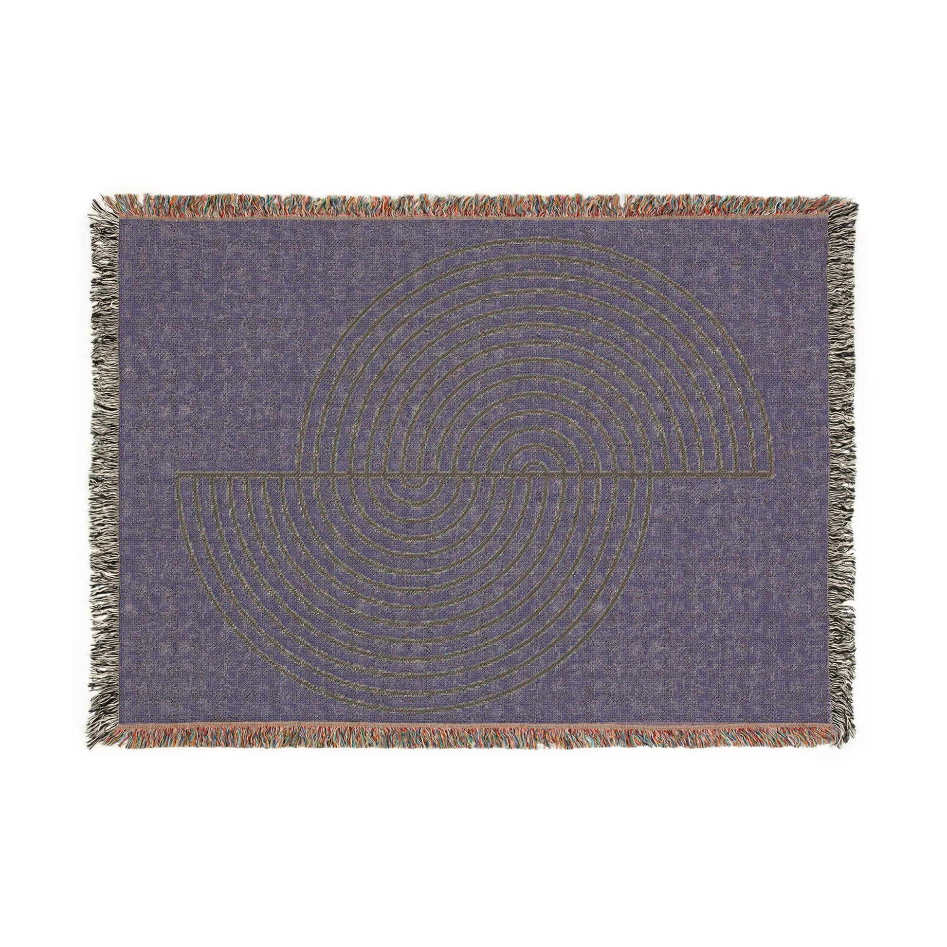 Decorative throw blanket with circular pattern on a plain background