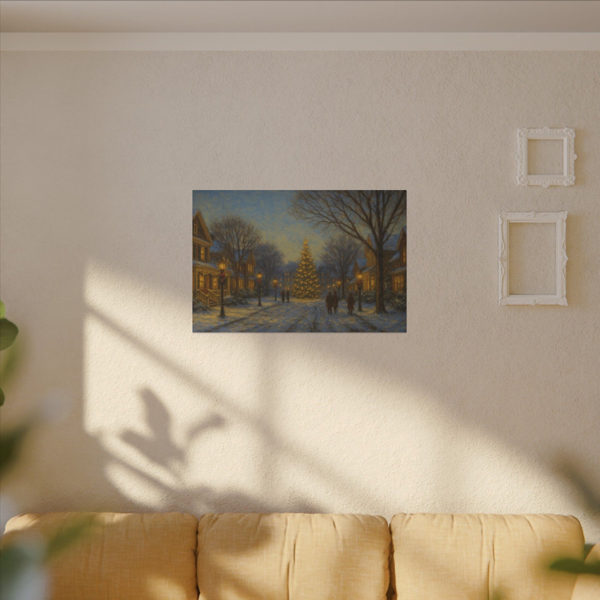 Framed artwork of a snowy street scene with a Christmas tree on a wall above a sofa.