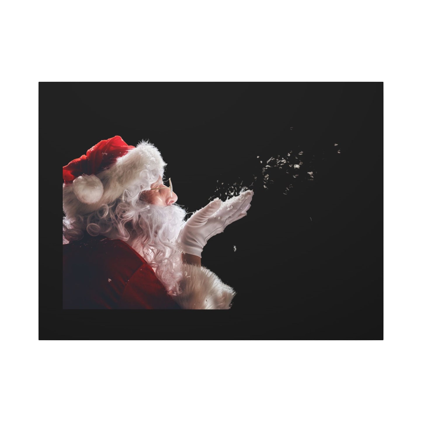 Santa Claus blowing snowflakes against a black background
