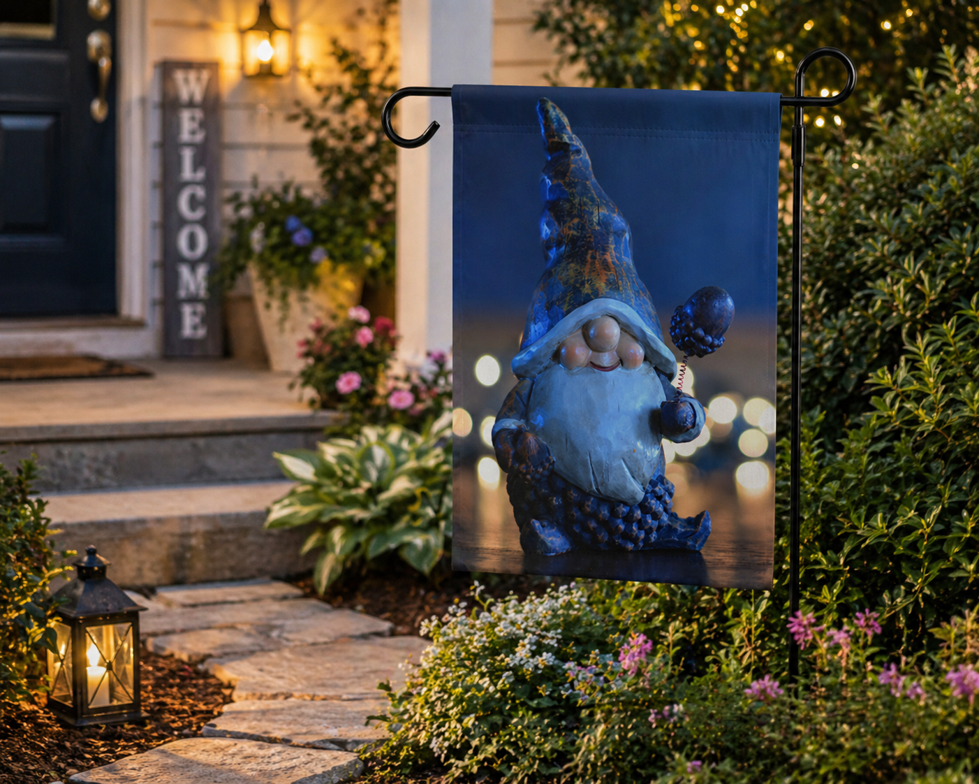 Gnome garden flag on a pole in front of a house with 'Welcome' sign and outdoor decor.