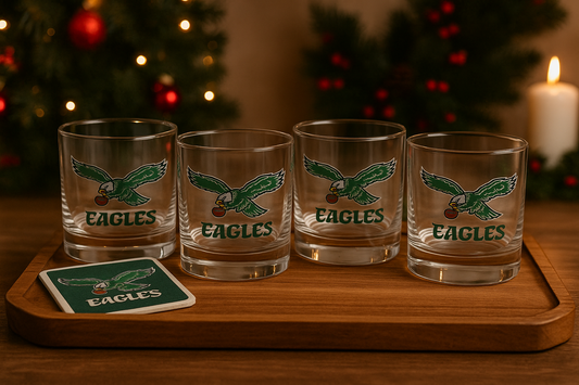 Four retro glasses on a wooden tray with a festive background.